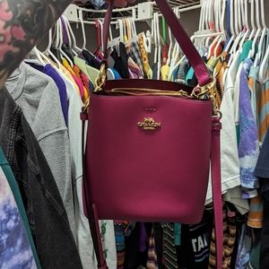 Lightly used coach hot pink bucket bag